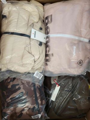 The photo shows a package with clothing in the category AJW.