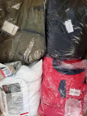 The photo shows a package with clothing in the category AJW.