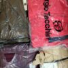 The photo shows a package with clothing in the category AJW.