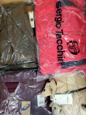 The photo shows a package with clothing in the category AJW.