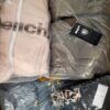 The photo shows a package with clothing in the category AJW.