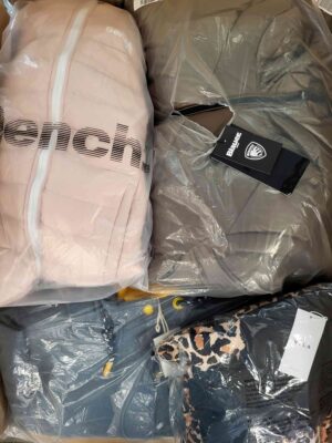 The photo shows a package with clothing in the category AJW.