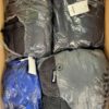 The photo shows a package with clothing in the category AJW.