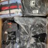 The photo shows a package with clothing in the category AJW.