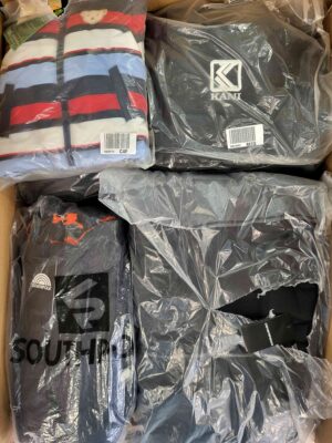 The photo shows a package with clothing in the category AJW.