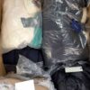 The photo shows a package with clothing in the category AJW.