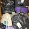 The photo shows a package with clothing in the category AJW.