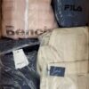 The photo shows a package with clothing in the category AJW.