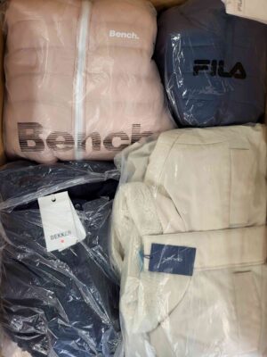 The photo shows a package with clothing in the category AJW.