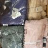 The photo shows a package with clothing in the category AJW.
