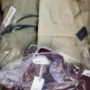 The photo shows a package with clothing in the category AJW.
