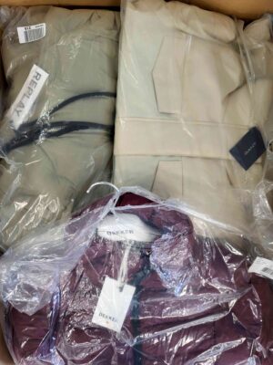 The photo shows a package with clothing in the category AJW.