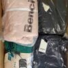 The photo shows a package with clothing in the category AJW.