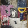 The photo shows a package with clothing in the category AW.