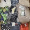 The photo shows a package with clothing in the category AW.