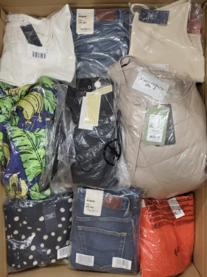 The photo shows a package with clothing in the category AW.
