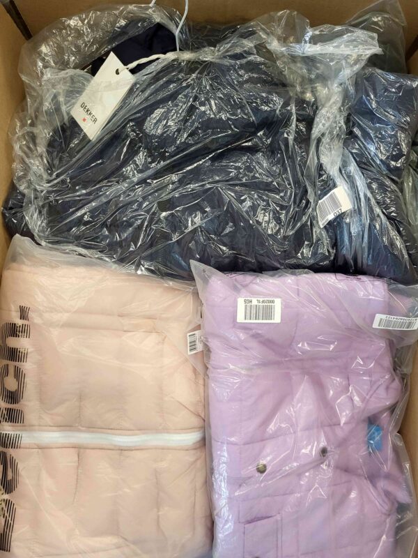 The photo shows a package with clothing in the category AJW.