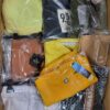 The photo shows a package with clothing in the category AW.