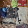 The photo shows a package with clothing in the category AW.