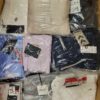The photo shows a package with clothing in the category AW.