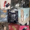 The photo shows a package with clothing in the category AW.