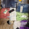 The photo shows a package with clothing in the category AW.