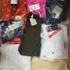The photo shows a package with clothing in the category AW.