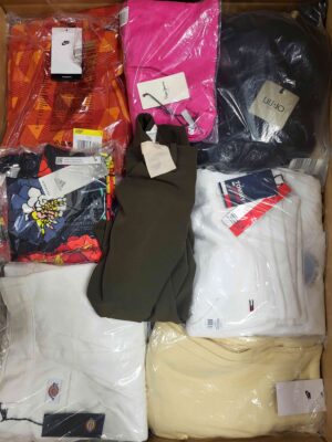 The photo shows a package with clothing in the category AW.