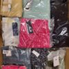 The photo shows a package with clothing in the category AW.