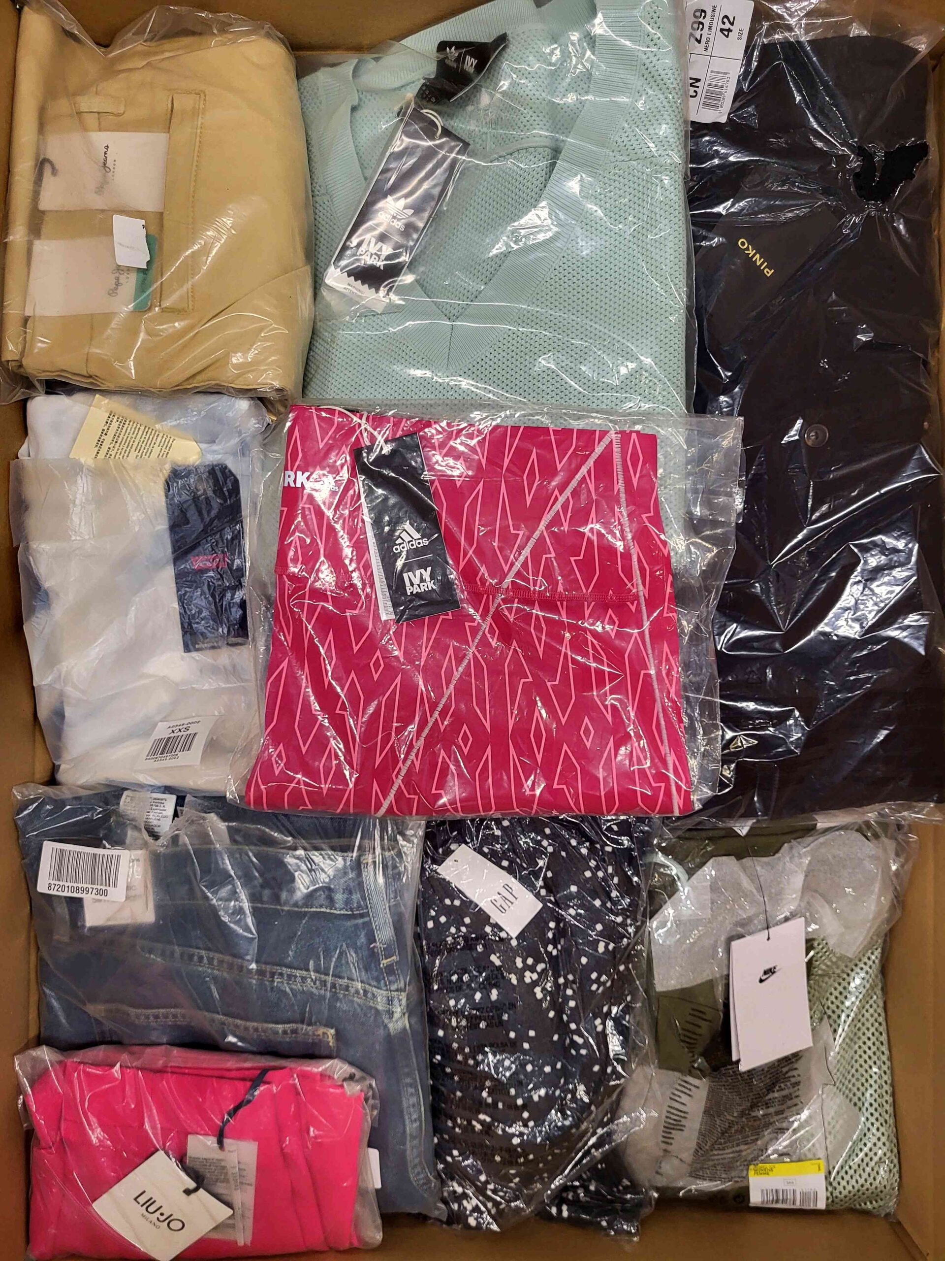 The photo shows a package with clothing in the category AW.