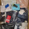 The photo shows a package with clothing in the category AW.
