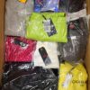 The photo shows a package with clothing in the category AW.