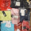 The photo shows a package with clothing in the category AW.