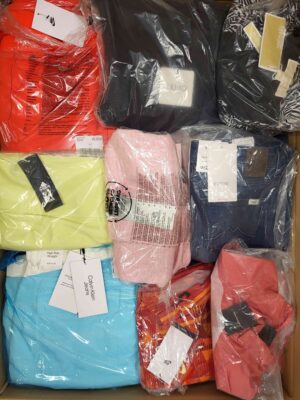 The photo shows a package with clothing in the category AW.