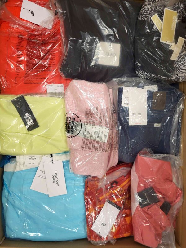 The photo shows a package with clothing in the category AW.