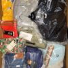 The photo shows a package with clothing in the category AW.
