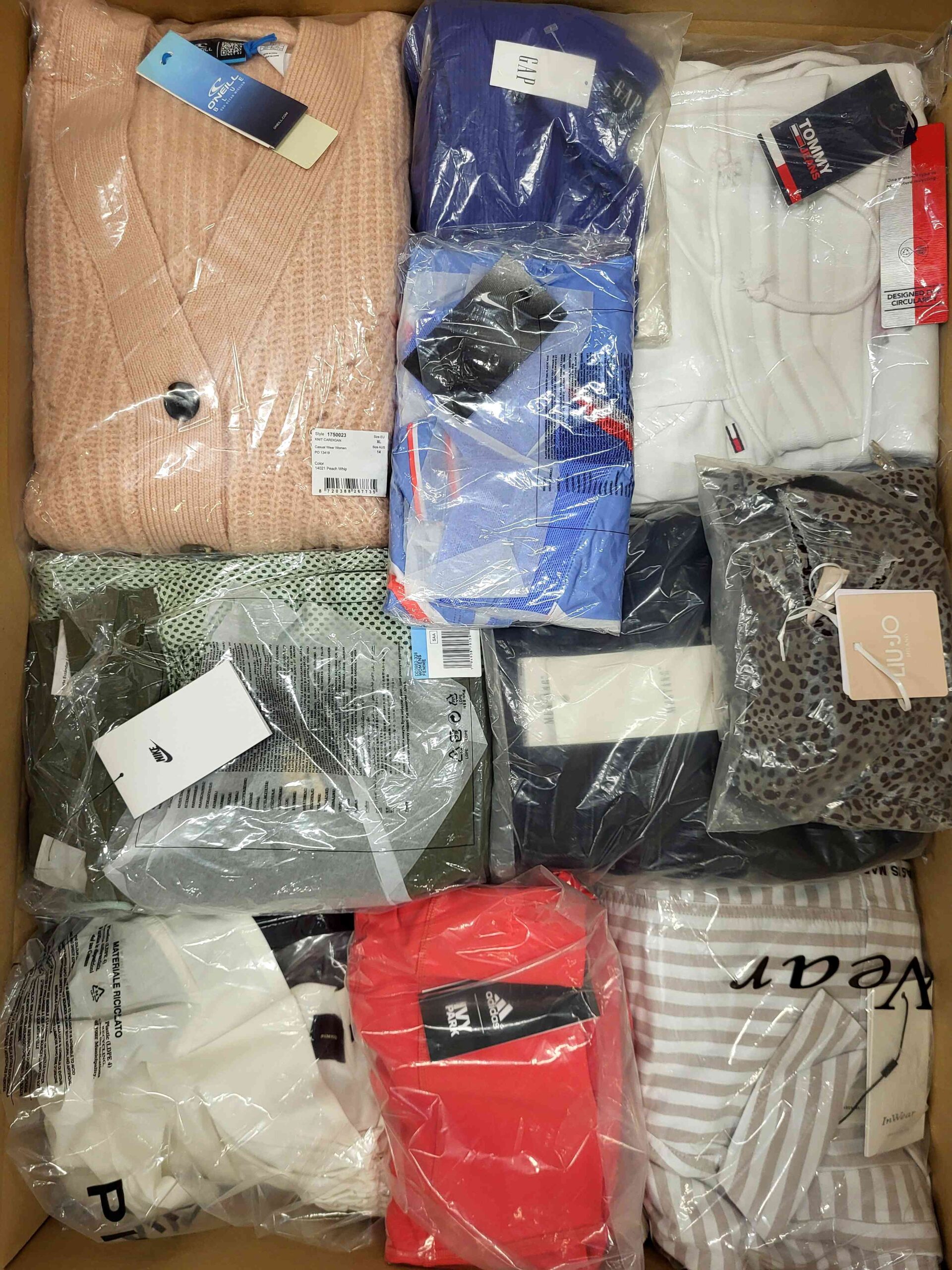 The photo shows a package with clothing in the category AW.
