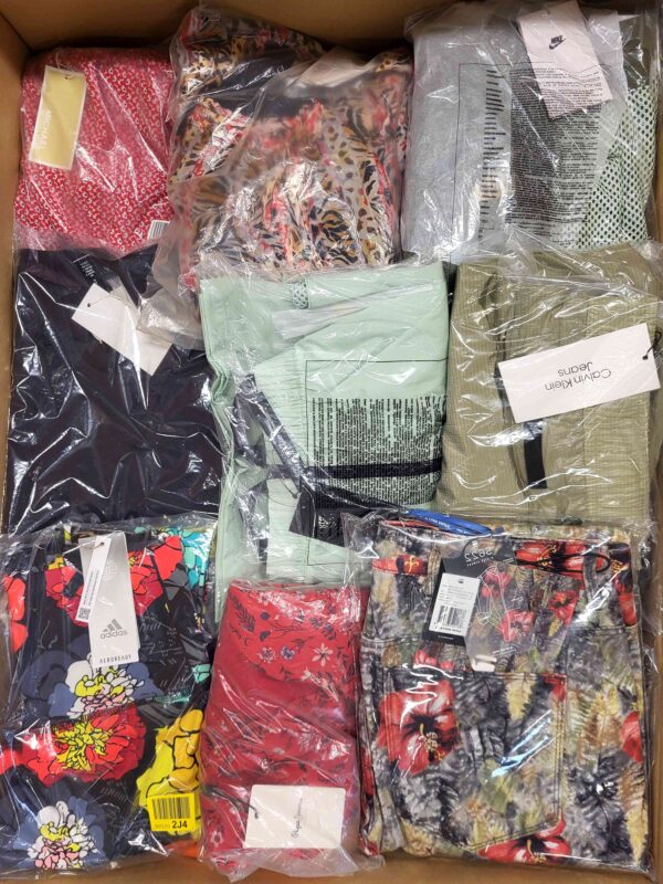 The photo shows a package with clothing in the category AW.