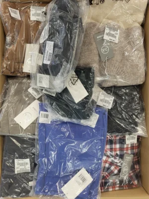 The photo shows a package with clothing in the category YA.
