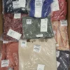 The photo shows a package with clothing in the category YA.