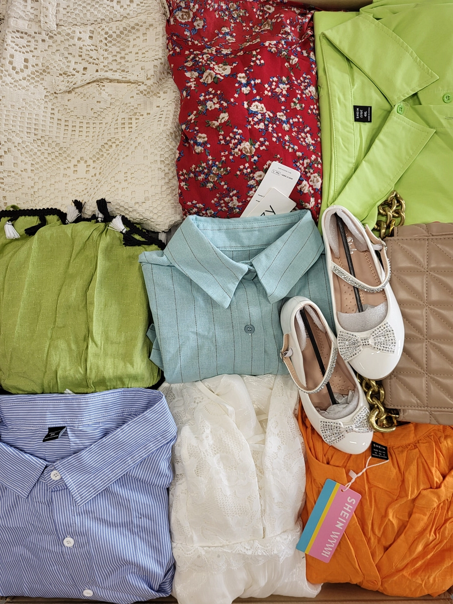 The photo shows a package with clothing in the category SN.