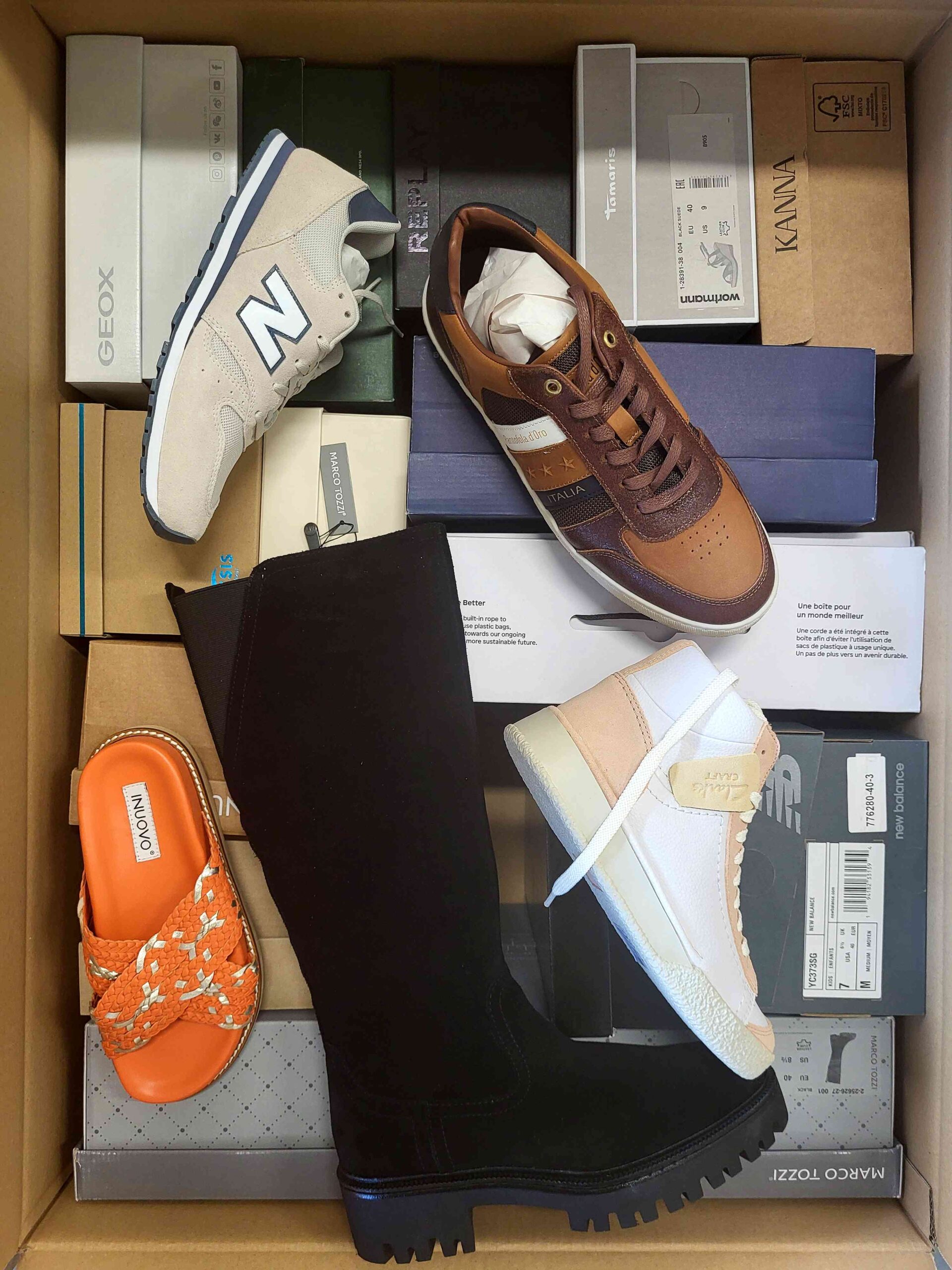 The photo shows a package with footwear in the category AS.