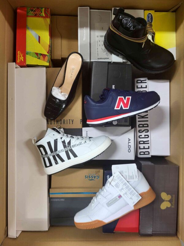 The photo shows a package with footwear in the category AS.