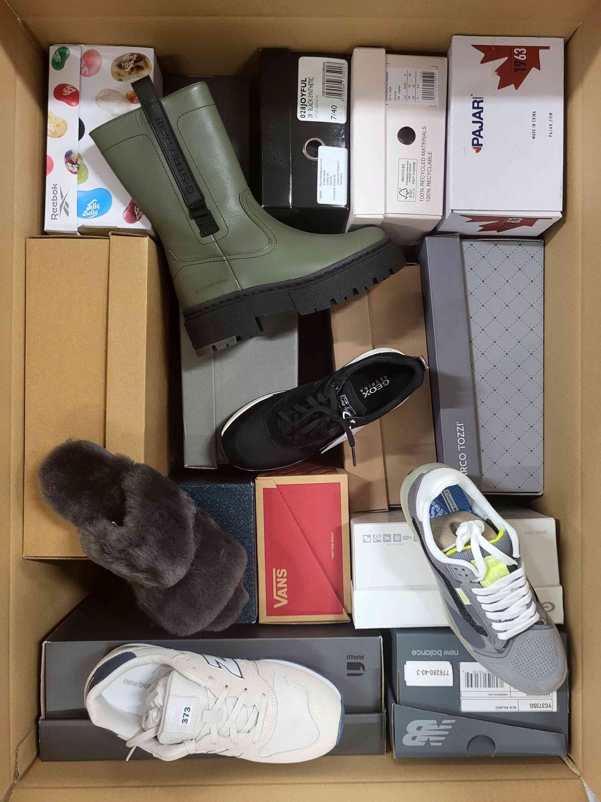 The photo shows a package with footwear in the category AS.