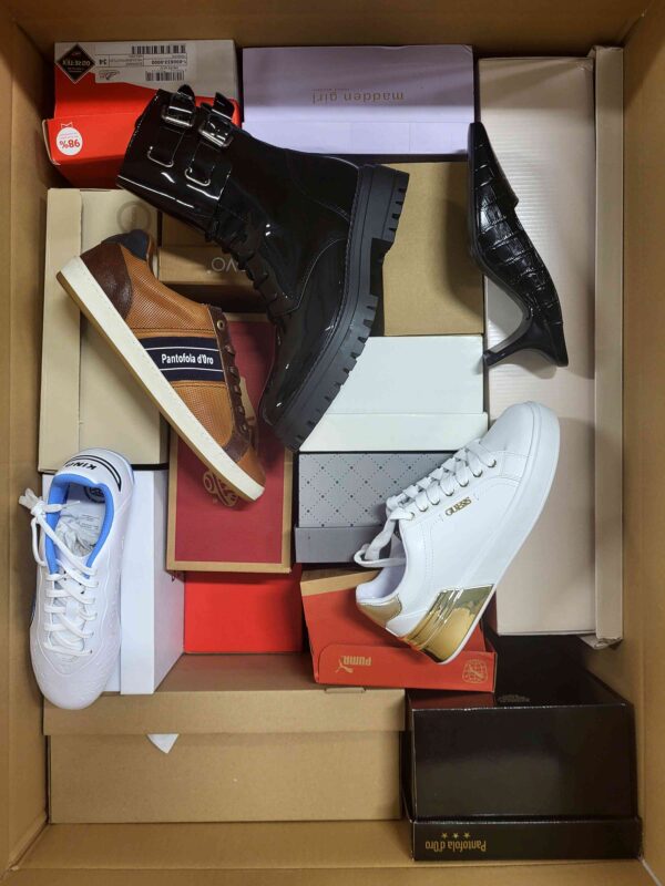 The photo shows a package with footwear in the category AS.