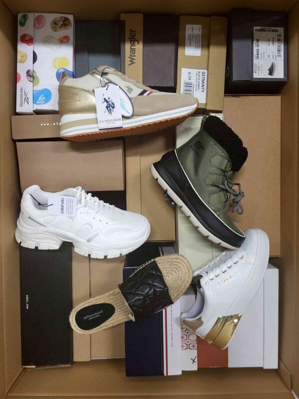 The photo shows a package with footwear in the category AS.