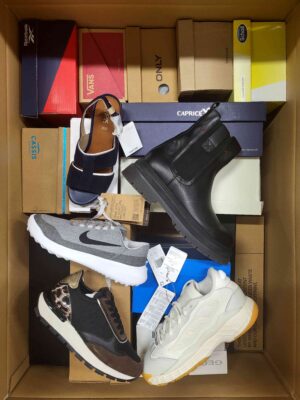 The photo shows a package with footwear in the category AS.