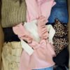 The photo shows a package with clothing in the category BSN.