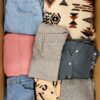 The photo shows a package with clothing in the category BSN.