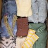 The photo shows a package with clothing in the category BSN.